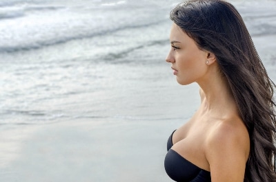 breast lift woman on beach