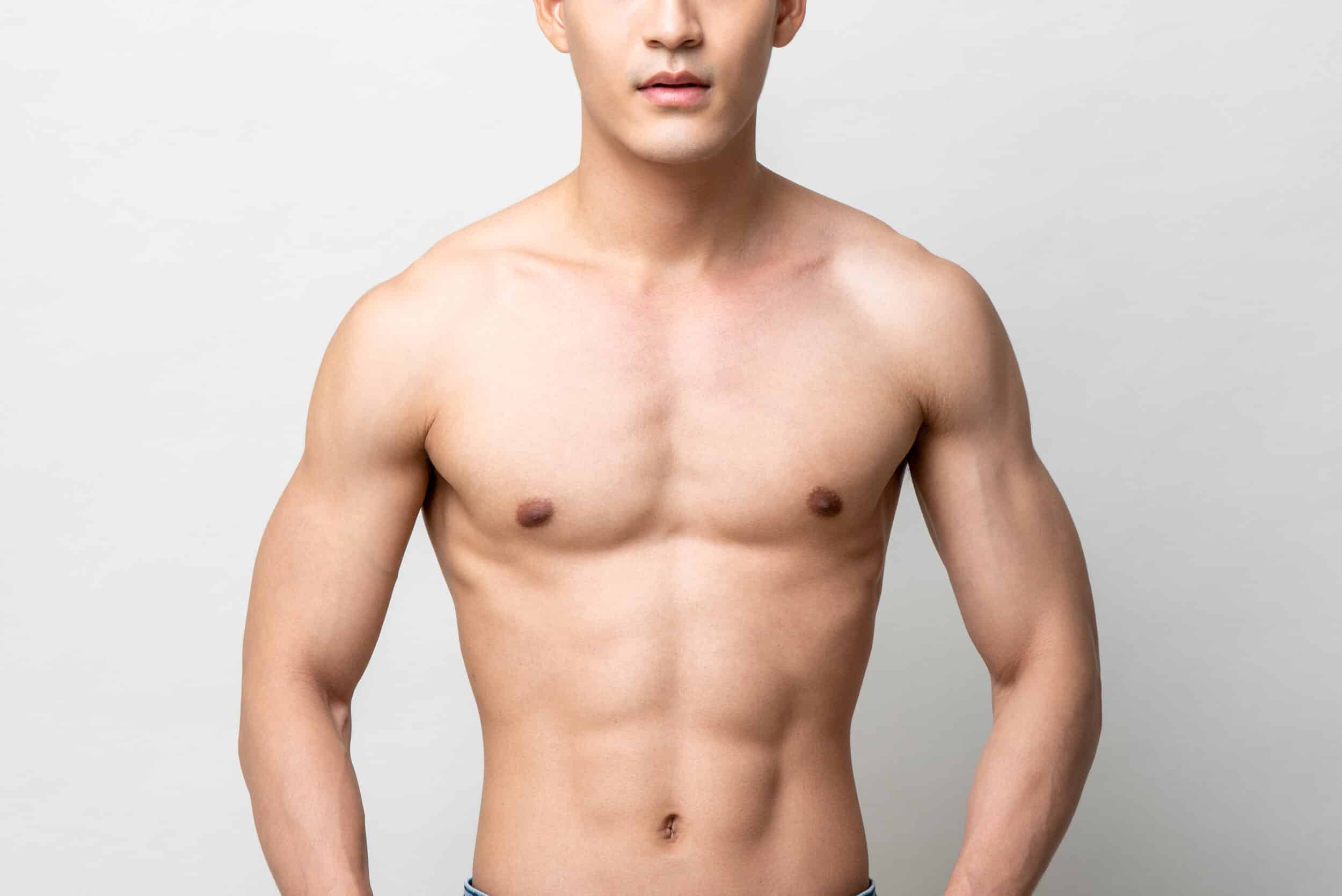 Orange County man with masculine contours following male breast reduction surgery to address gynecomastia.