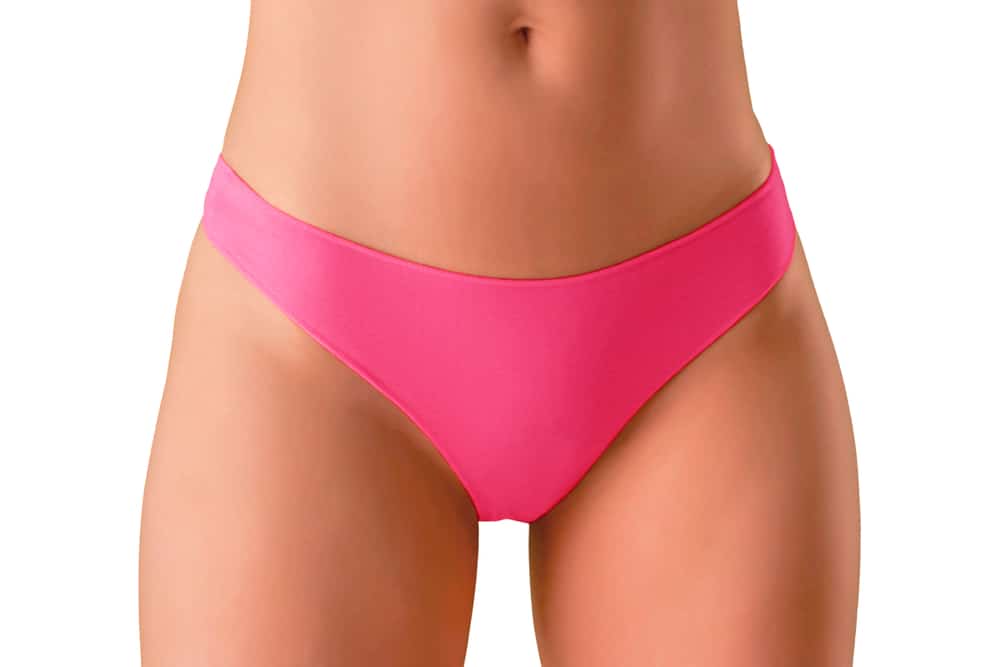 Woman in pink bikini bottoms after labiaplasty in Huntington Beach, CA