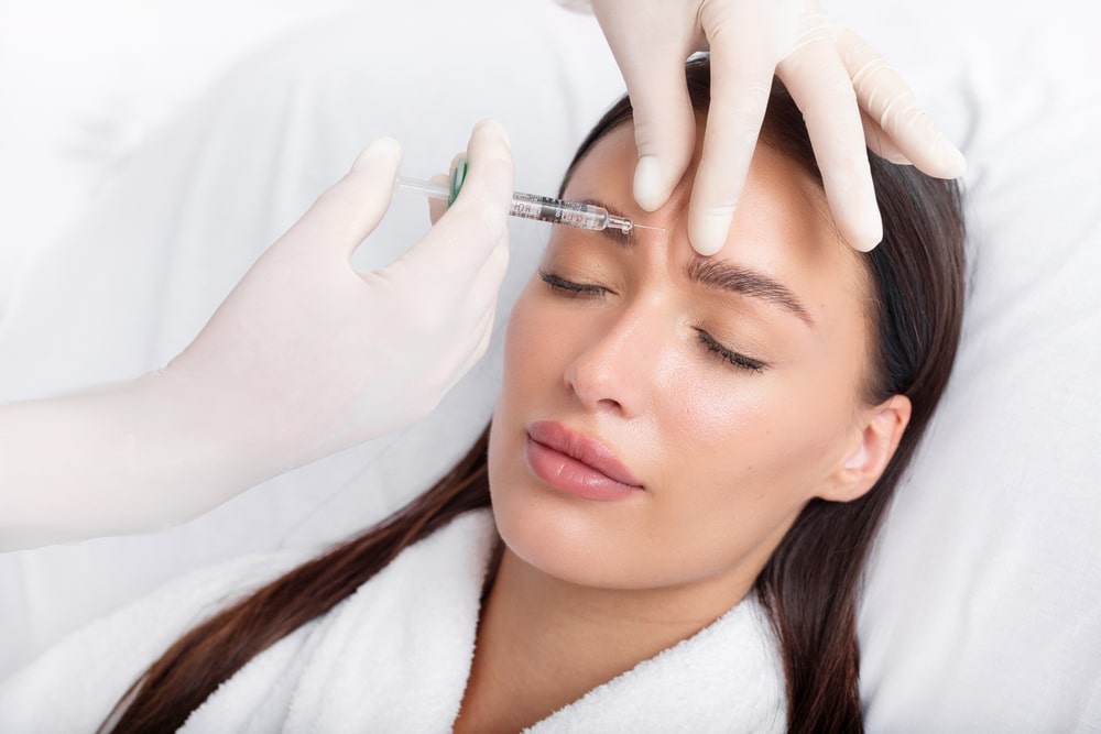 Relaxed woman getting Dysport injections in frown lines in Huntington Beach, CA